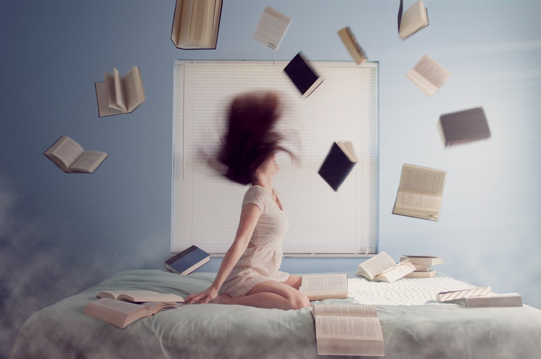 Flying books writing frustration Photo by Lacie Slezak on Unsplash