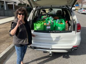 Linden Gross with the Bend Food Project bags she collects to help curb hunger.